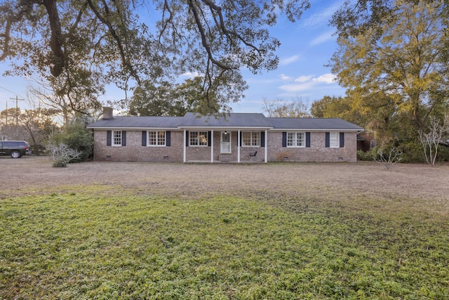 ranch-style home featuring a front yard