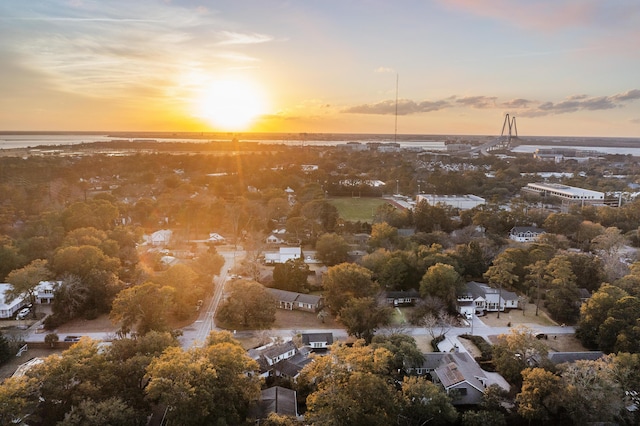 aerial view at dusk with a water view