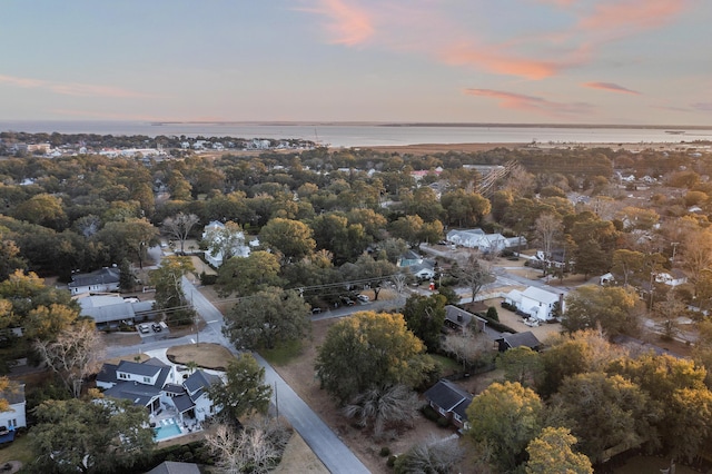 aerial view at dusk with a water view