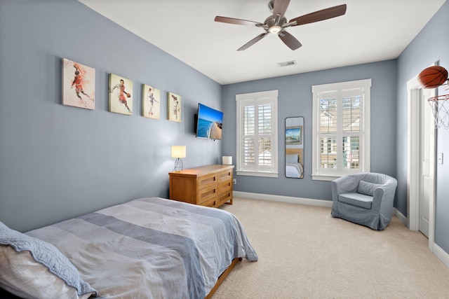 carpeted bedroom with ceiling fan