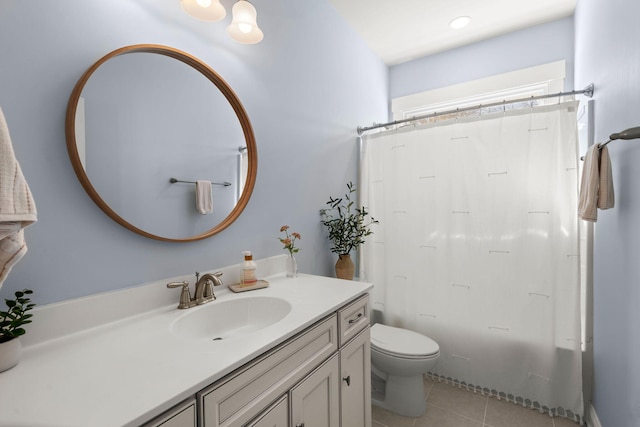 full bathroom featuring tile patterned floors, vanity, toilet, and shower / tub combo with curtain