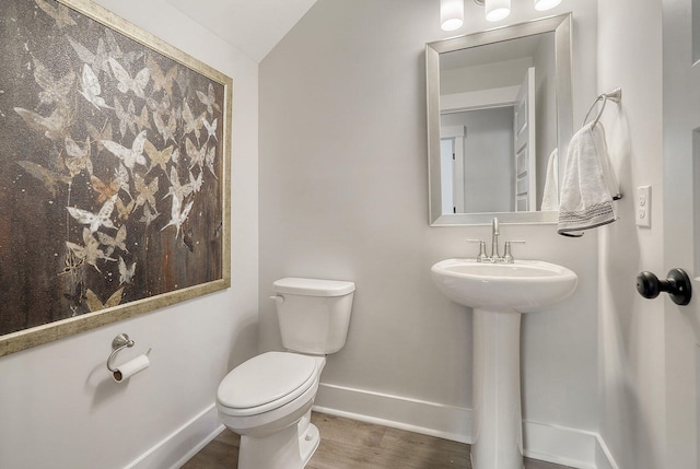 bathroom featuring toilet and hardwood / wood-style floors