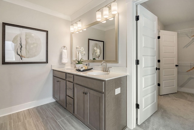 bathroom featuring vanity and crown molding