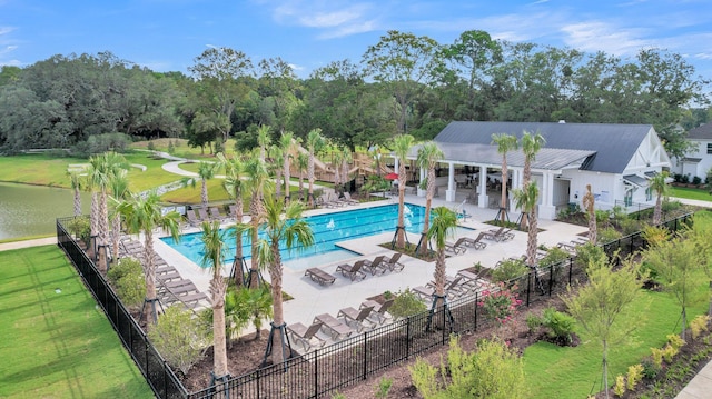 view of pool featuring a yard and a patio