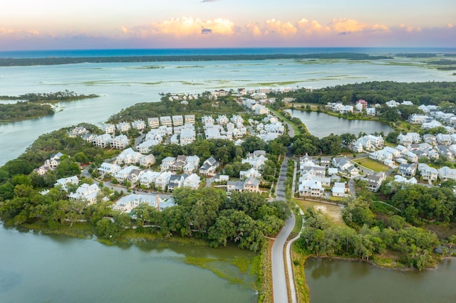 aerial view at dusk with a water view