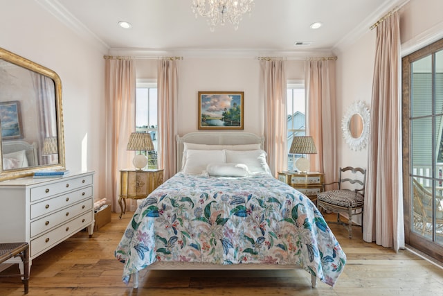 bedroom featuring light hardwood / wood-style floors, multiple windows, and crown molding