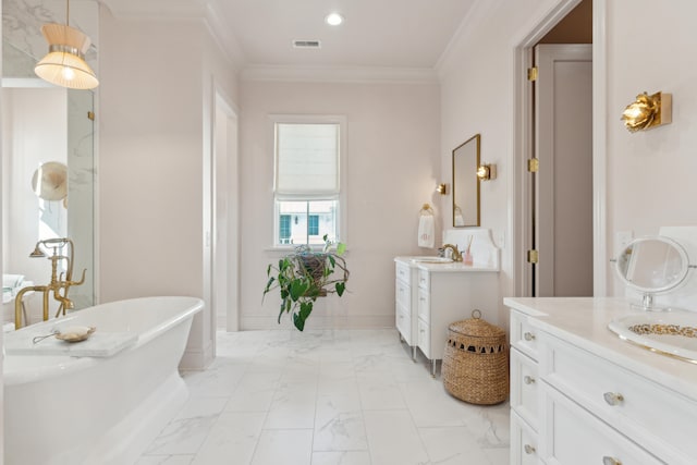 bathroom with a bathing tub, vanity, and ornamental molding