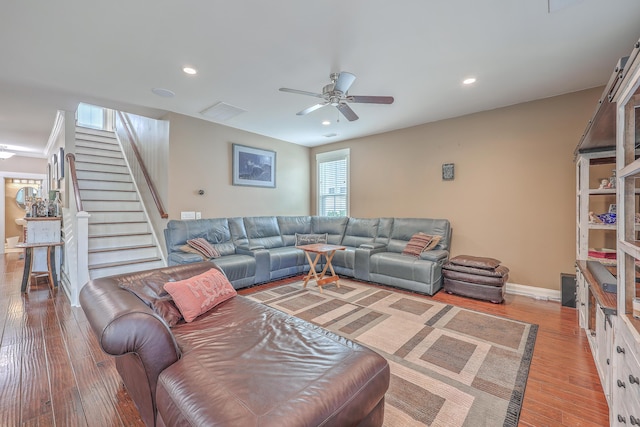 living room featuring ceiling fan and wood-type flooring