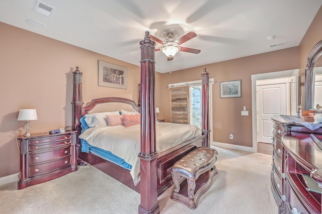 bedroom with ceiling fan and light colored carpet