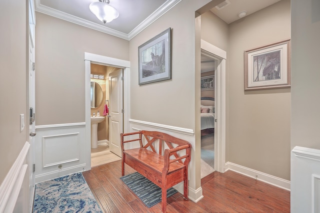 hall featuring crown molding and wood-type flooring