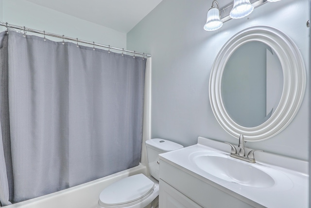 full bathroom featuring shower / bathtub combination with curtain, vanity, and toilet