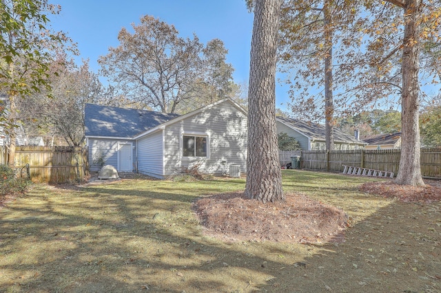 back of property featuring a lawn