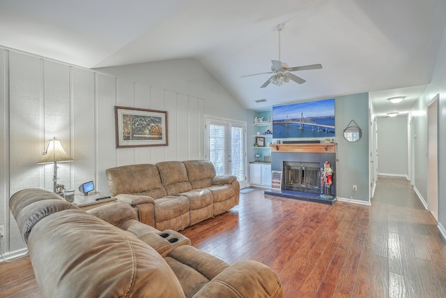 living room featuring hardwood / wood-style floors, ceiling fan, lofted ceiling, and french doors