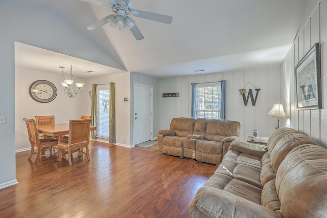 living room featuring hardwood / wood-style flooring, ceiling fan with notable chandelier, and lofted ceiling