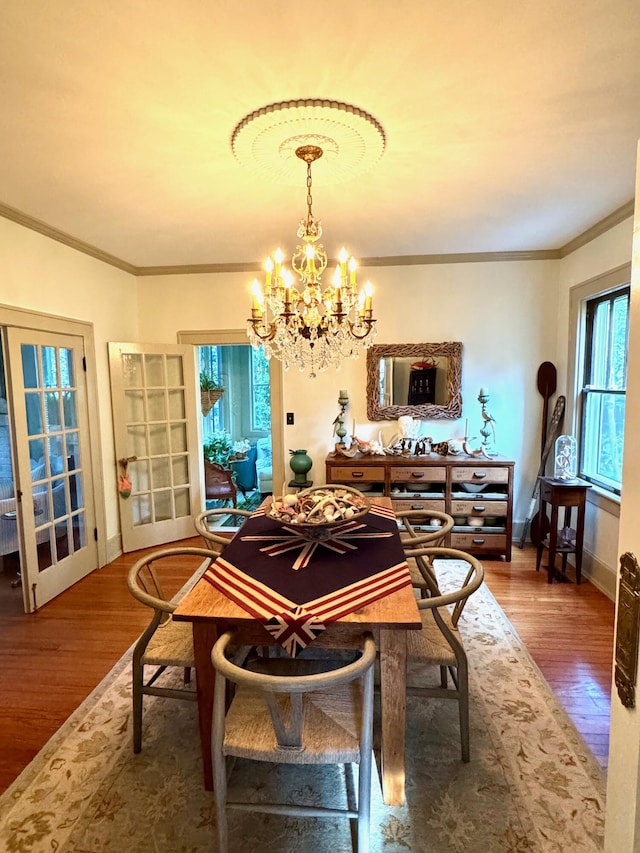 2066 Wappoo Dr, Charleston, SC 29412 - dining space with a chandelier, ornamental molding, and wood finished floors
