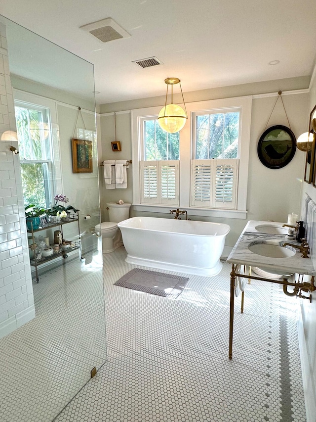 2066 Wappoo Dr, Charleston, SC 29412 - full bath with a freestanding bath, double vanity, and walk in shower