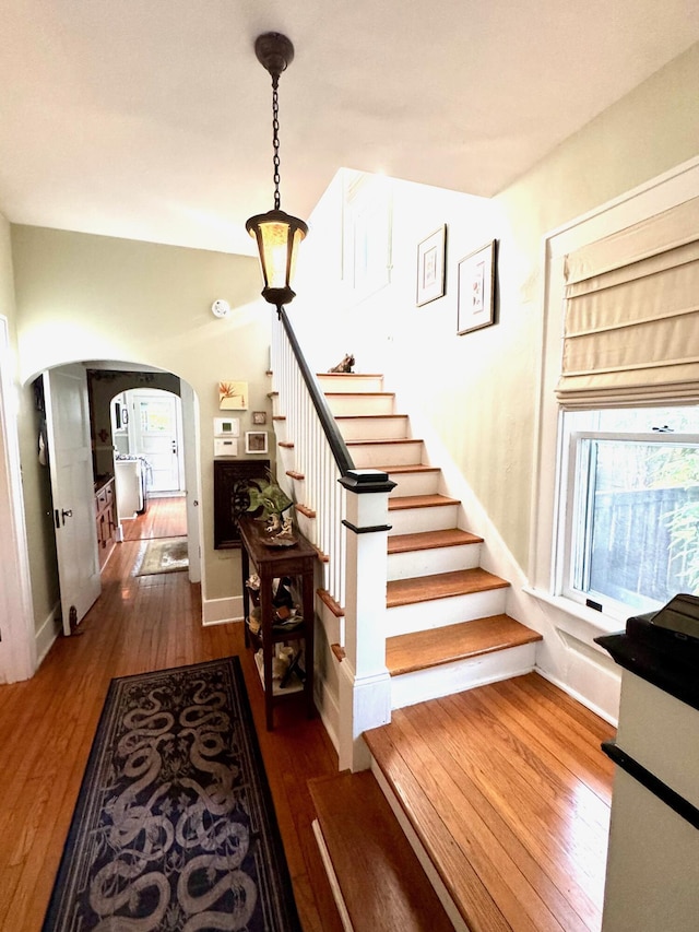 2066 Wappoo Dr, Charleston, SC 29412 - staircase featuring arched walkways and wood-type flooring