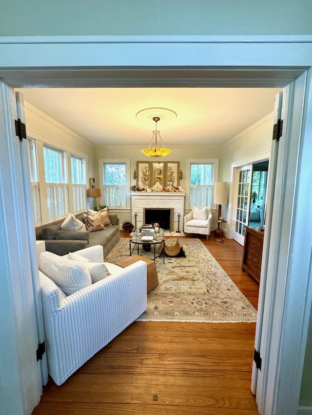 2066 Wappoo Dr, Charleston, SC 29412 - living room with crown molding, a fireplace, plenty of natural light, and wood finished floors