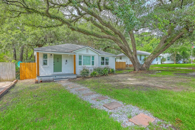 1188 Camden St, North Charleston, SC 29405 - view of front facade with covered porch, brick siding, and roof with shingles