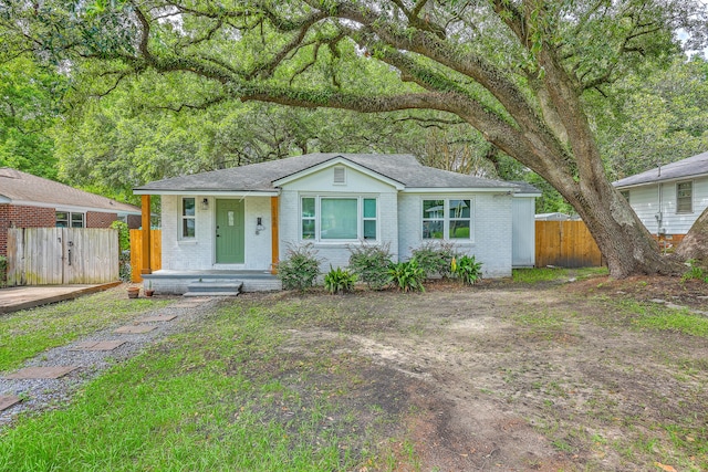 1188 Camden St, North Charleston, SC 29405 - view of front of house with brick siding, roof with shingles, and a gate