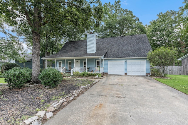 view of front facade with a garage and a porch