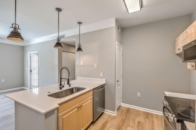 kitchen featuring light brown cabinetry, decorative light fixtures, sink, light hardwood / wood-style floors, and stainless steel appliances