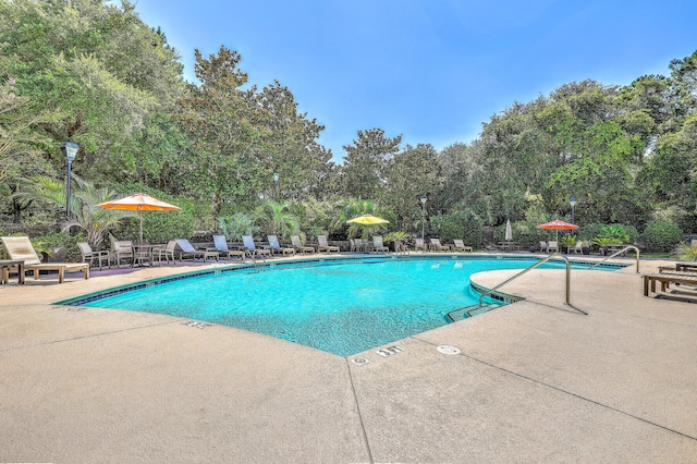 view of swimming pool featuring a patio