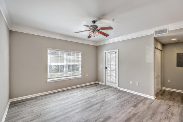 empty room with crown molding, ceiling fan, and light hardwood / wood-style flooring