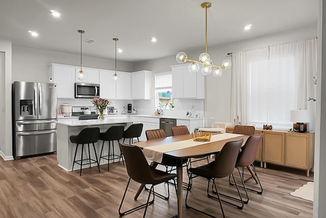 513 Donnas View Way, Summerville, SC 29486 - dining room featuring wood finished floors, recessed lighting, and a chandelier
