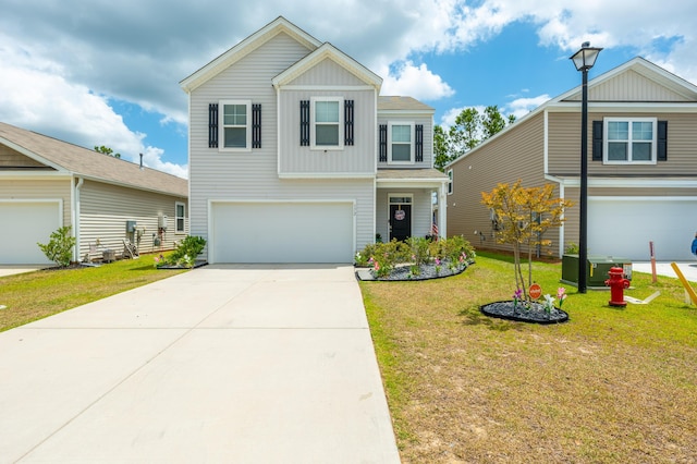 view of front of house with a garage and a front lawn