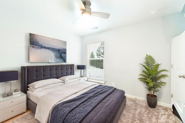 bedroom with light colored carpet and ceiling fan