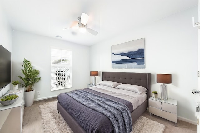 bedroom featuring ceiling fan and light colored carpet