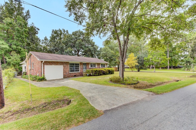 single story home featuring a front yard and a garage