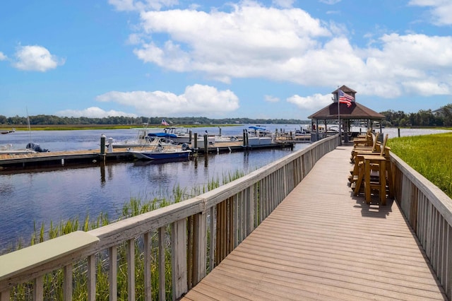 view of dock with a water view and a gazebo