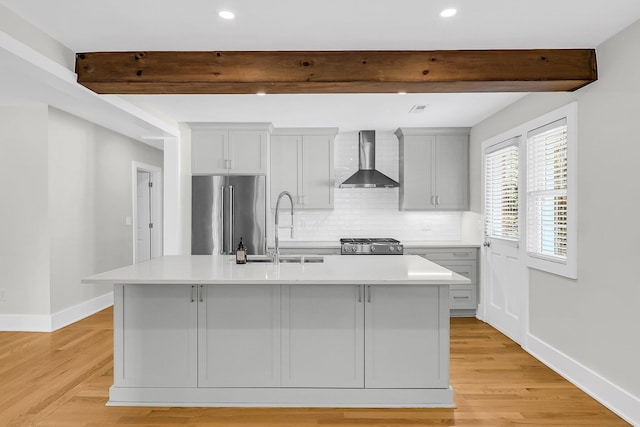 31 Lyttleton St, Charleston, SC 29407 - kitchen with high end fridge, wall chimney range hood, a sink, beam ceiling, and a kitchen island with sink