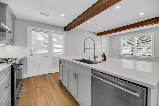 31 Lyttleton St, Charleston, SC 29407 - kitchen featuring appliances with stainless steel finishes, a sink, light wood-type flooring, beamed ceiling, and recessed lighting