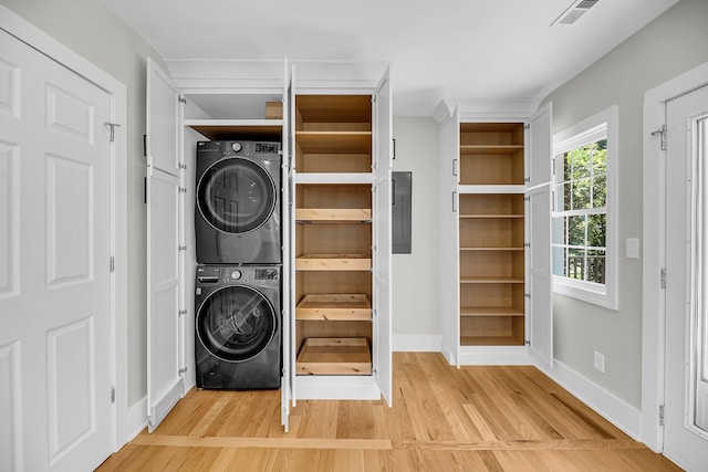 31 Lyttleton St, Charleston, SC 29407 - washroom featuring estacked washer and dryer, light wood-type flooring, baseboards, and electric panel