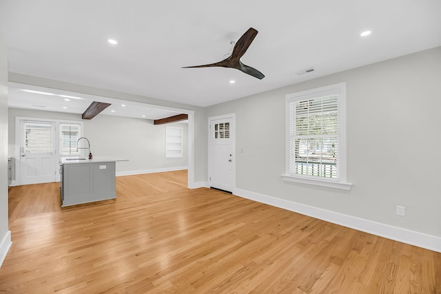 31 Lyttleton St, Charleston, SC 29407 - unfurnished living room featuring light wood-type flooring, a sink, ceiling fan, baseboards, and recessed lighting