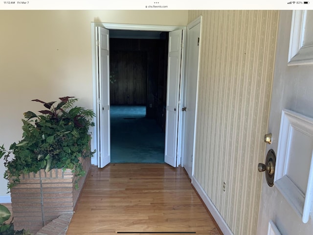 hallway featuring light wood-style flooring