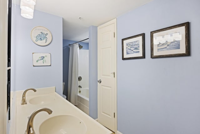 full bath featuring shower / bath combo and double vanity