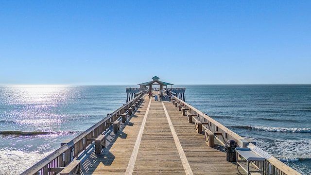 dock area with a pier and a water view