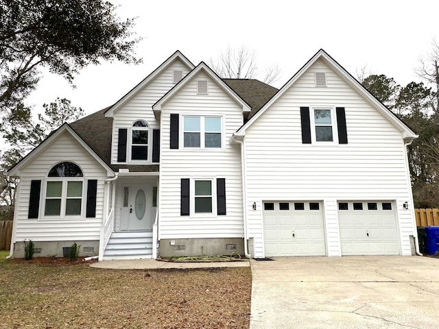 traditional-style house with a garage, crawl space, roof with shingles, and driveway