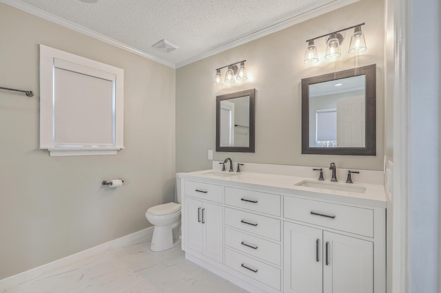 bathroom featuring marble finish floor, a textured ceiling, toilet, and a sink