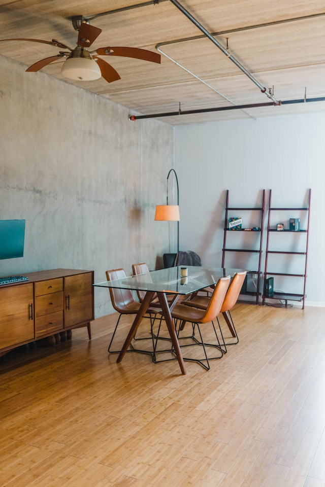 dining room featuring light hardwood / wood-style flooring and ceiling fan