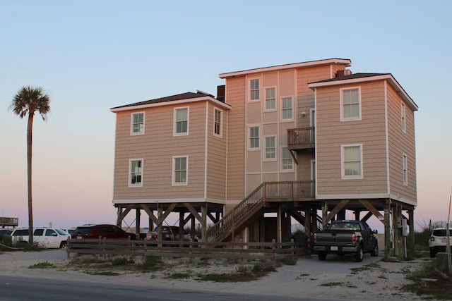 view of outdoor building at dusk