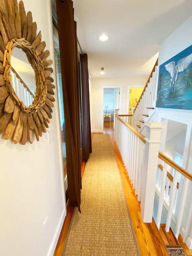 hallway with light wood-type flooring