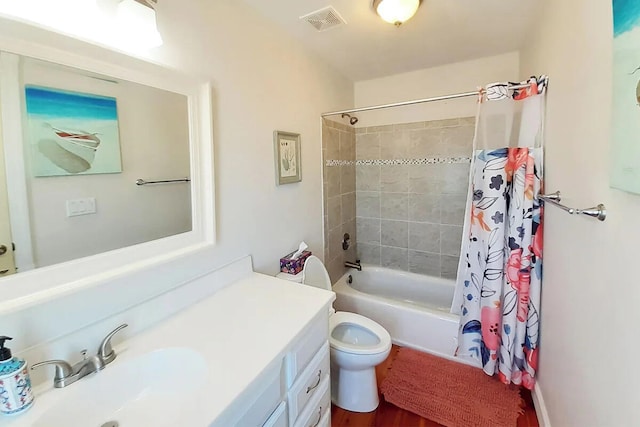 full bathroom with shower / bath combo with shower curtain, vanity, hardwood / wood-style floors, and toilet