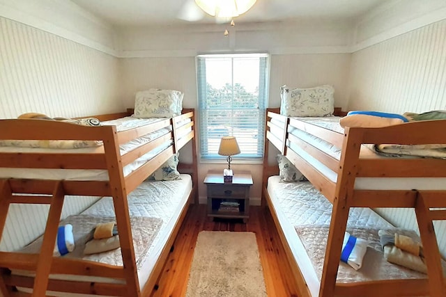 bedroom with dark hardwood / wood-style flooring