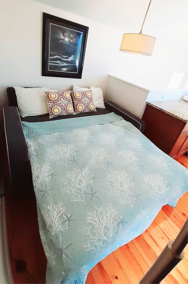 bedroom featuring wood-type flooring