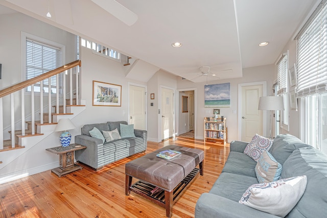 living room featuring ceiling fan and wood-type flooring